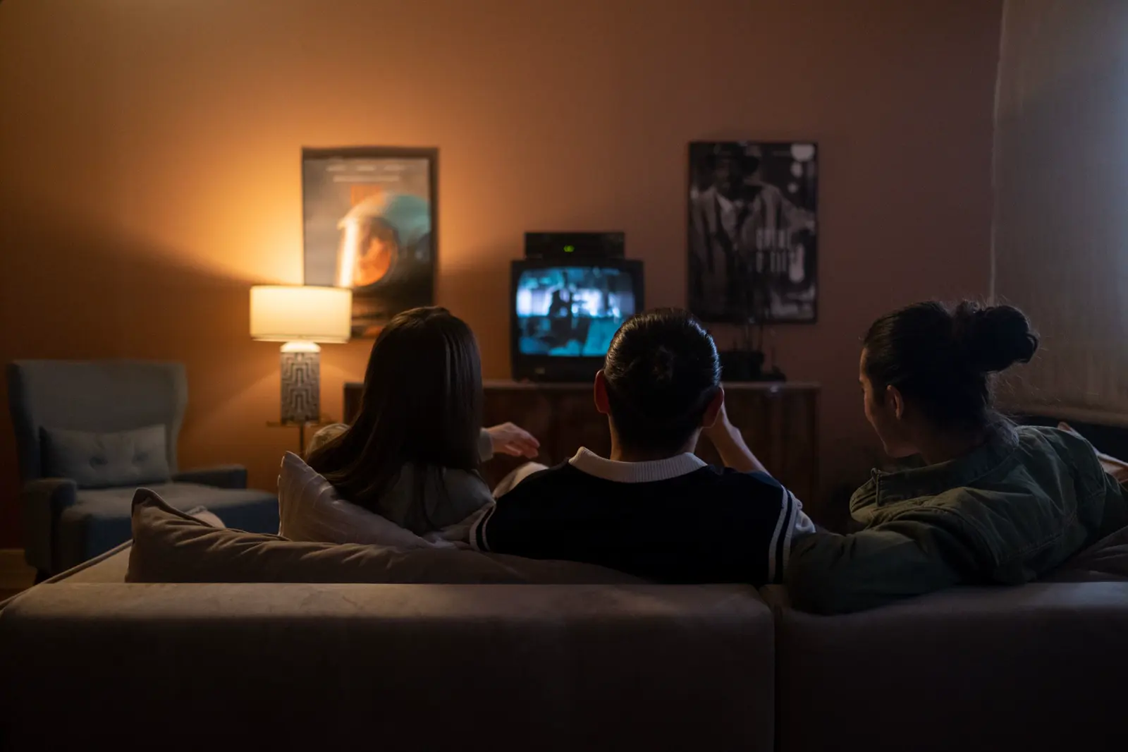 Friends watching a movie together at home